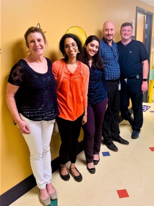 Students pose in the hall of the hospital.